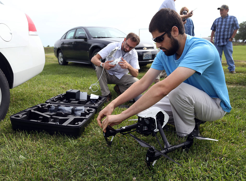 Muhammad Al-Rawi and Kris Corbett prepare their drone